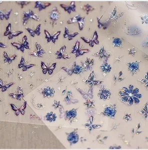 Detail of holographic laser butterfly and rose nail art stickers with M-512 coding