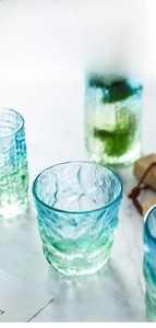 Detail of glacier texture glass with blue and green gradient finish for cold drinks