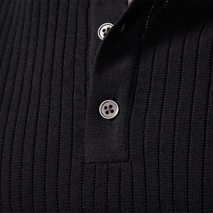 Men's black knit Henley shirt featuring vertical ribbed texture and two-button placket detail