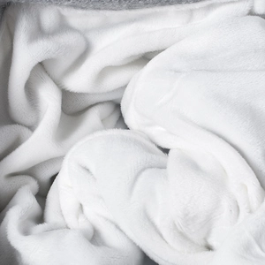 Winter thick fleece-lined white knit beanie for women providing warmth and outdoor protection