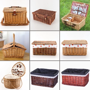 Handwoven wicker picnic basket set with leather straps and multiple fabric linings