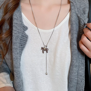 Silver pony pendant necklace with star detail on a sleek snake chain for women