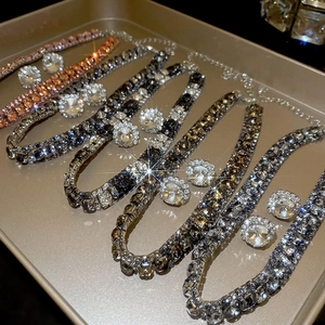 Close-up of four cubic zirconia jewelry sets with matching necklaces and earrings