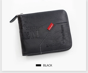 Detail view of black textured leather wallet with metal zipper and embossed logo