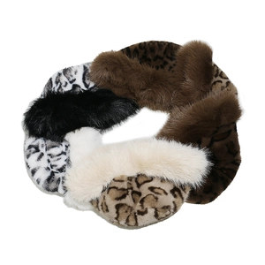 Detail of colorful leopard print and faux fur scrunchies showing plush texture and design