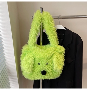 Close-up of a fluorescent green fluffy plush bag with a cute cartoon dog face design