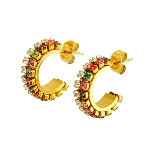 Golden C-shaped hoop earrings with colorful inlaid rhinestones on a white background