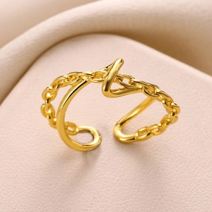 Detailed macro shot of gold-plated chunky chain ring with minimalist polished texture