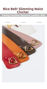 Detail view of genuine cowhide wide belts with vintage gold triangle buckles and rivets