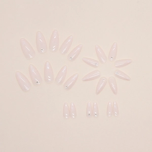 Pink Aurora almond press-on nails with fine rhinestones on beige background