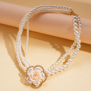 Elegant multi-layer pearl necklace featuring a large resin camellia flower and rhinestones