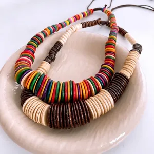 Vintage bohemian necklace set featuring colorful wooden beads and coconut shell discs