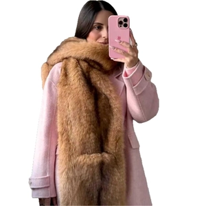 Brown faux fox fur scarf shawl draped over a pink coat for winter warmth