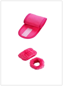 Detail showing the plush texture and Velcro closure of the rose pink headband and wristbands