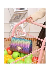 Close-up of rainbow gradient woven crossbody bag with gold chain and metal twist lock