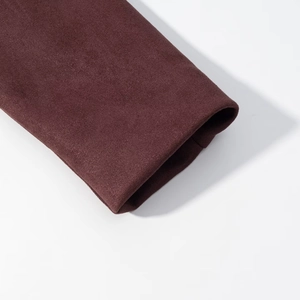Close-up of deep burgundy faux suede jacket cuffs showing thick premium fabric texture