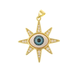 Close-up of golden Evil Eye pendant with blue pupil and sparkling cubic zirconia stones