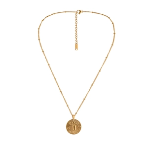 Detail of gold stainless steel coin necklace with Scorpio zodiac relief and beaded chain