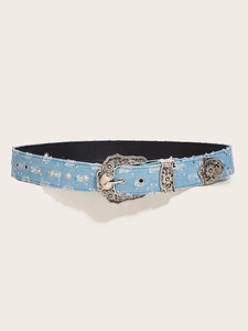 Detail of light blue denim western belt with sequins and engraved silver metal buckle