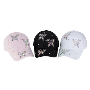 Three-piece set of stylish baseball caps in pink, black, and white with rhinestone butterflies