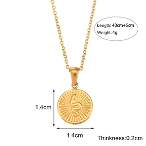 Detail of golden round pendant with snake relief engraving and product dimensions