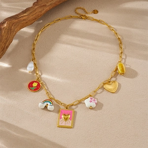 Detailed view of gold necklace with colorful enamel charms like heart, flower and rainbow