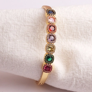 Gold-plated open bangle with colorful square gemstones and sparkling micro-pave detailing