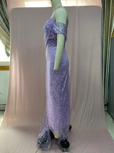 Side view of a purple sequined evening dress with straps on a professional mannequin
