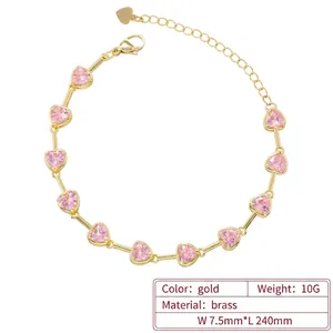Elegant gold-plated brass bracelet featuring pink heart crystals and bamboo-style links