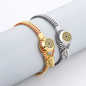 Close-up of titanium steel zipper bracelets with gold and silver woven rope textures
