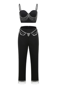 Detail of black camisole with heart-shaped cups and sparkling silver rhinestone fringe