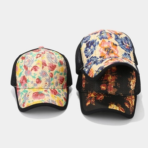 Three stylish straw weave trucker hats with floral prints and breathable mesh backs