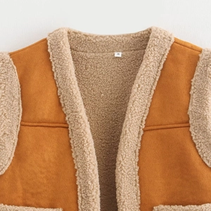 Brown faux suede vest with beige faux shearling lining and trim in a minimalist style