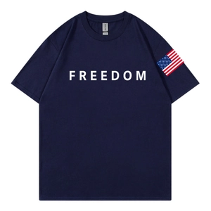 Navy blue cotton T-shirt with Freedom print and American flag sleeve detail in flat lay