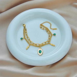 Double-layered gold titanium steel bracelet with green turquoise and lightning charms