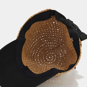 Japanese style straw visor hat with a contrasting black bow and woven texture detail