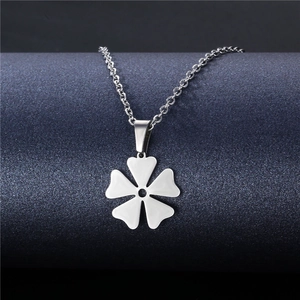 Polished stainless steel five-petal flower pendant necklace on a blue display stand