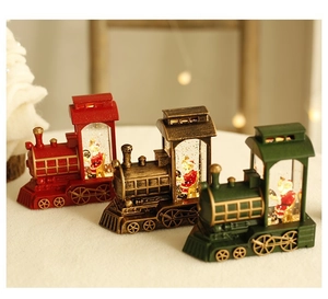 Three decorative Christmas train snow globes featuring Santa Claus with warm LED lighting