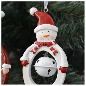 Detailed view of snowman Christmas tree ornament with a white hollow star metal bell