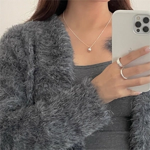 Mirror selfie showing 925 sterling silver ball pendant necklace and matching rings