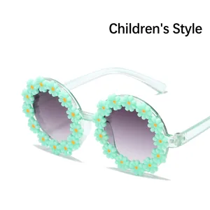 Cute flower-shaped sunglasses for girls with mint green frames and purple gradient lenses