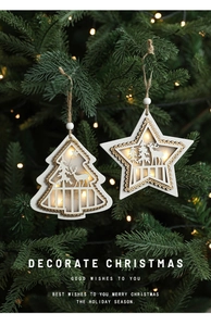 Close-up of glowing wooden star and tree ornaments with deer carvings on a Christmas tree