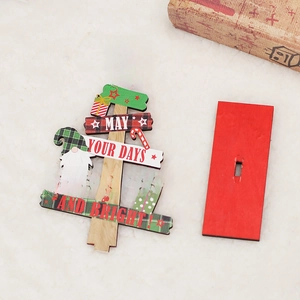 Christmas wooden tree tabletop decoration with festive lettering and gnome on red base