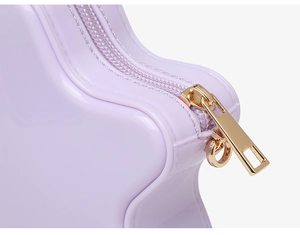 Detailed close-up of lavender PVC star bag showing high-gloss finish and gold zipper pull