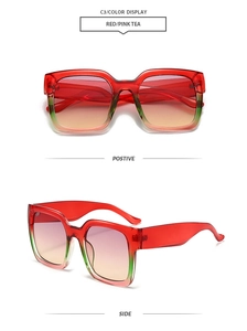 Detail view of square oversized frames with red and green gradient finish and tea lenses