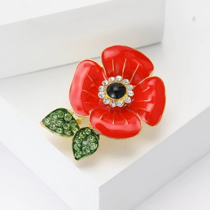 Exquisite red enamel poppy flower brooch with crystal rhinestones on a white pedestal