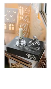 Close-up of clear crystal glass pillar candle holder on a table for elegant home decor