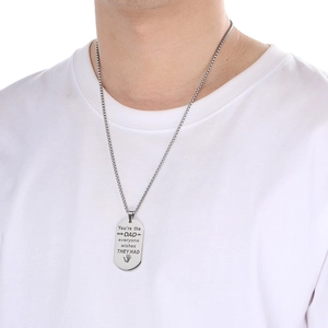 Close-up of engraved stainless steel dad dog tag necklace with sentimental message