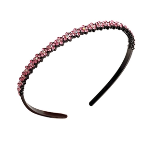 Pink rhinestone headband with black anti-slip teeth base for elegant hair styling