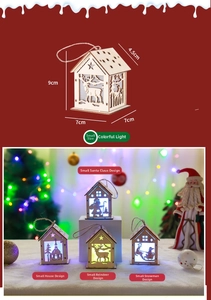 Close-up of wooden Christmas LED house ornament with reindeer and Santa cutout details